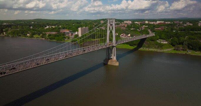Aerial of traffic on Mid Hudson Bridge over Hudson River in Poughkeepsie New York on Bright Sunny Summer Day