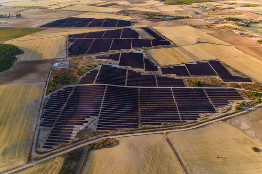 Aerial view of the solar power station with solar panels at sunset in Spain, Renewable Energy, Solar Energy, Saelices, Cuenca, Castilla La Mancha, Spain
