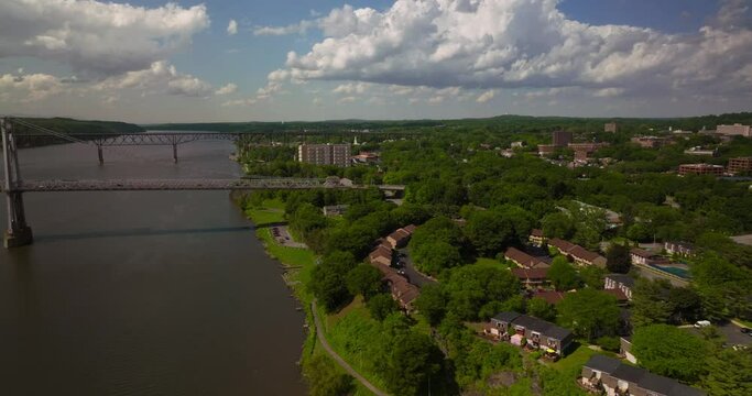 Aerial of Poughkeepsie Hudson River waterfront Bridge on beautiful sunny day