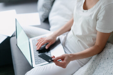 woman using notebook computer and shopping online