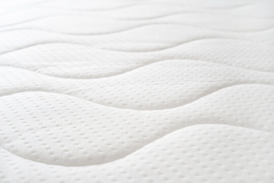 background of soft comfortable quilted white mattress