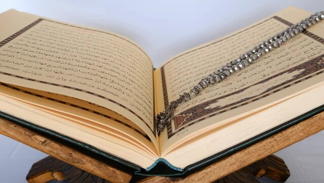 Quran Kareem muslim holy book and rosary