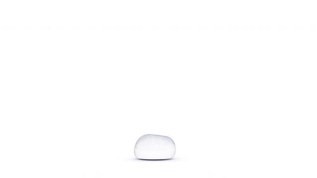 A single droplet falling down and staying whole instead of splashing into smaller drops.