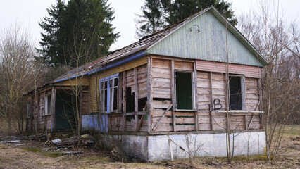 An old abandoned and ruined wooden house