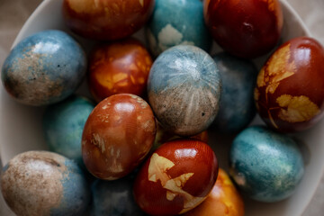 Naturally coloured Easter eggs close up in brown and blue colors
