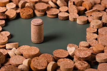Recycling symbol and wine cork for secondary use.