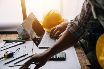 Construction and structure concept of Engineer or architect meeting for project working with partner and engineering tools on model building and blueprint in working site, contract for both companies.