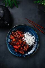 Pork in Thai sweet chili sauce in a plate.