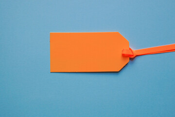 orange price tag on the blue background