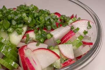 Fresh vitamin salad. Vegetarian dish. Healthy Eating. Diet plate. Summer menu. Pieces of fresh vegetables. Vegetable oil. Seasonal products. Ukrainian cuisine.
