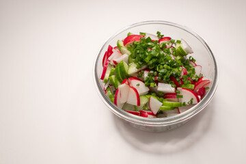 Fresh vitamin salad. Vegetarian dish. Healthy Eating. Diet plate. Summer menu. Pieces of fresh vegetables. Vegetable oil. Seasonal products. Ukrainian cuisine.