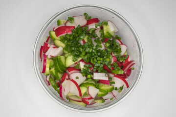 Fresh vitamin salad. Vegetarian dish. Healthy Eating. Diet plate. Summer menu. Pieces of fresh vegetables. Vegetable oil. Seasonal products. Ukrainian cuisine.