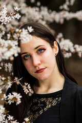 unaltered imagery skincare dermatology beauty. Hispanic woman portrait with cherry blossom