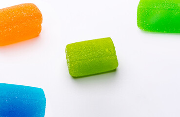 A group of colorful candy on a white background