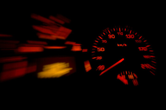 Selective focus on the car speedometer isolated on black background. Speed concept