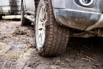 Fototapeta na wymiar off-road vehicle with muddy wheels. Driving off-road and in bad weather