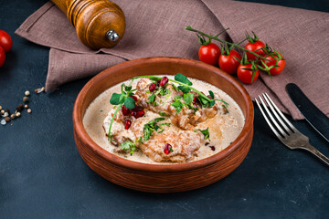 Georgian food soup chikhirtma with meat, pomegranate seeds and herbs.