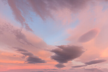 Pink blue sky with clouds at beautiful sunset as natural background.