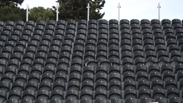 Black benches installed for people watching the marathon