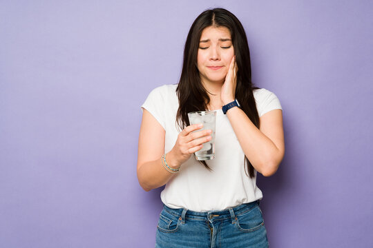 Sad woman with teeth sensitivity