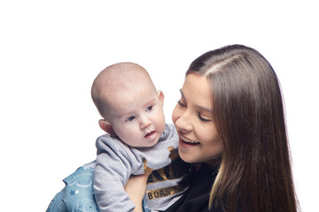 Young girl with a baby in her arms, joy with a newborn laughing
