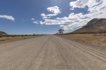 Fototapeta na wymiar straight gravel road in africa
