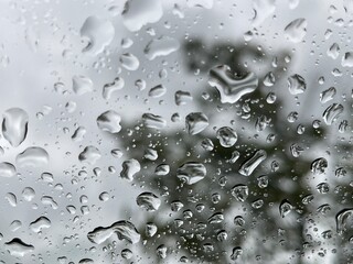 a drop of water in the window on a rainy day
