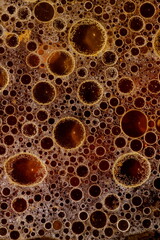 Macro view on the liquid with oil added.