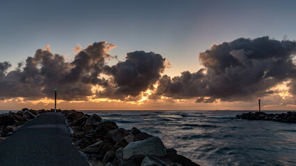 Sunrise over the sea at Wooli Head, Wooli, NSW, Australia - red & green lateral marks show the port...