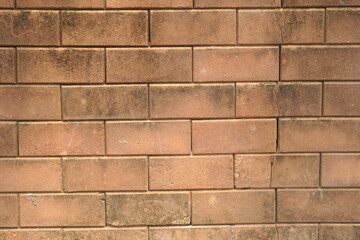 Brown block brick wall background, building wall
