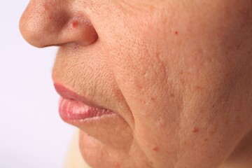 Fototapeta premium Closeup view of older woman on white background