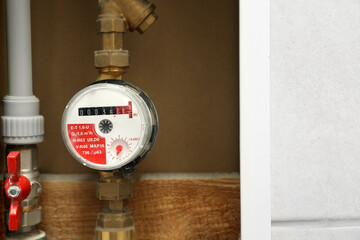 Electric meter in fuse box, space for text. Water measuring device