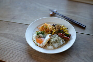 A breakfast plate with some of the most popular Japanese food.