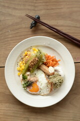 A breakfast plate with some of the most popular Japanese food.
