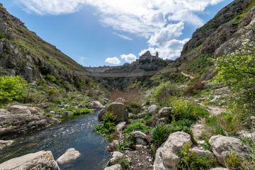 View of the Sassi of Matera from the Tibetan bridge over the Gravina stream.