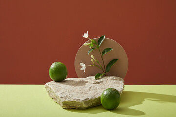 Scene for display cosmetic of lime extract with stone podium and fresh limes on color background. Lime extract rich in vitamin C and nutrients for effective skin care and is widely used in cosmetics