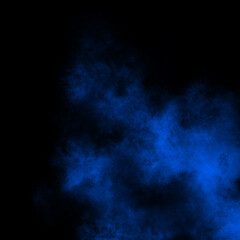 Blue color powder explosion isolated on black background. Royalty high-quality free stock photo image of Blue powder explosion. Colorful dust explode. Paint Holi, Blue dust particles splash