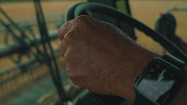 Farmer driving soybean harvester