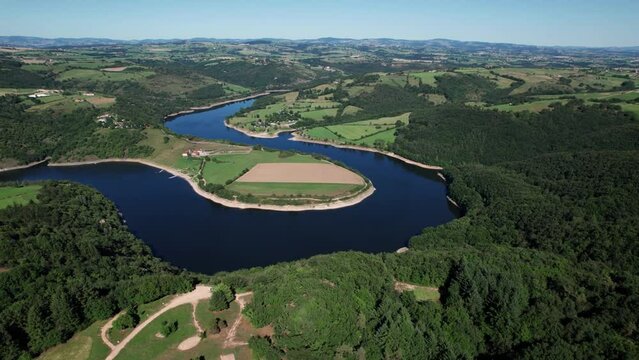 drone shot of the Loire River at the spot called Pet d'Ane with the green countryside around and the blue dark water