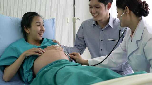 Doctor examination of pregnant for baby at hospital. Asian doctor visit patient woman and suggest physical examination of pregnant for baby at hospital.
