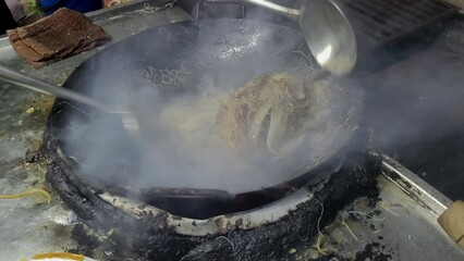 Char Hor Fun, popular Asian Chinese street fast food in hot wok, Char Hor Fun is stir fried flat rice noodle dish commonly served as a street food and at casual local eateries in Malaysia.