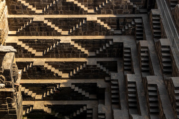 Ancient Indian step well in Jaipur, India, Architecture of stairs at Abhaneri Baori step well in Jaipur, Rajasthan, India.