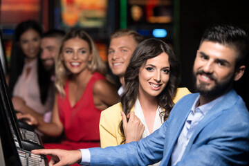 Group of People at Automat Machine in Casino