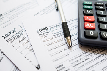Fototapeta premium United States Tax forms background for individual tax return. Business and Tax concept.