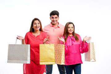 Indian people group holding shopping bags on white background.