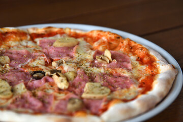 Close up photo of pizza on wooden table