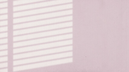 The light from the window shines on the wall