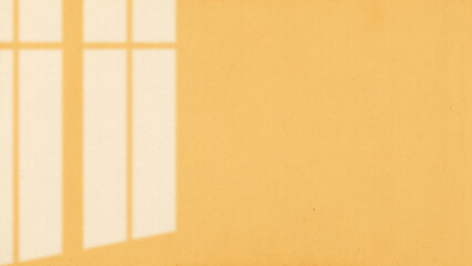 The light from the window shines on the wall