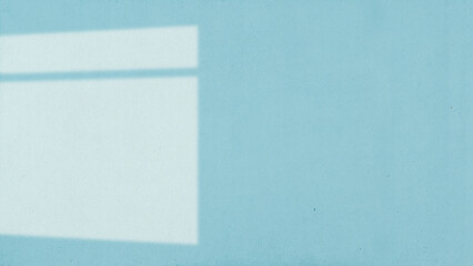 The light from the window shines on the wall