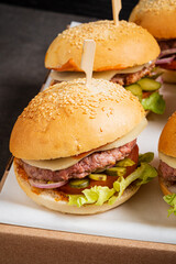 small burgers on the catering table